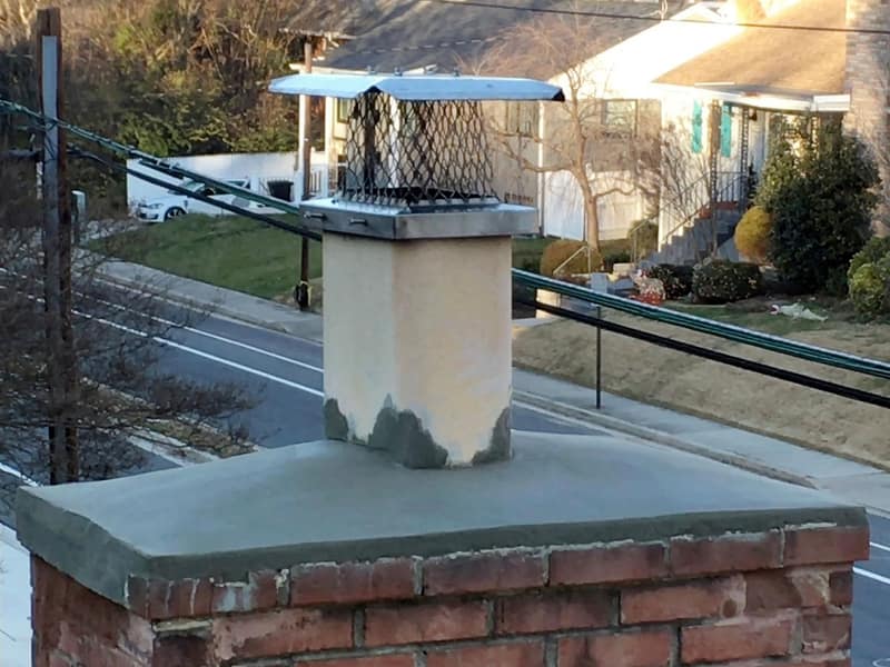 stainless mesh cap fitted above a new crown on a chimney in Toms River, NJ