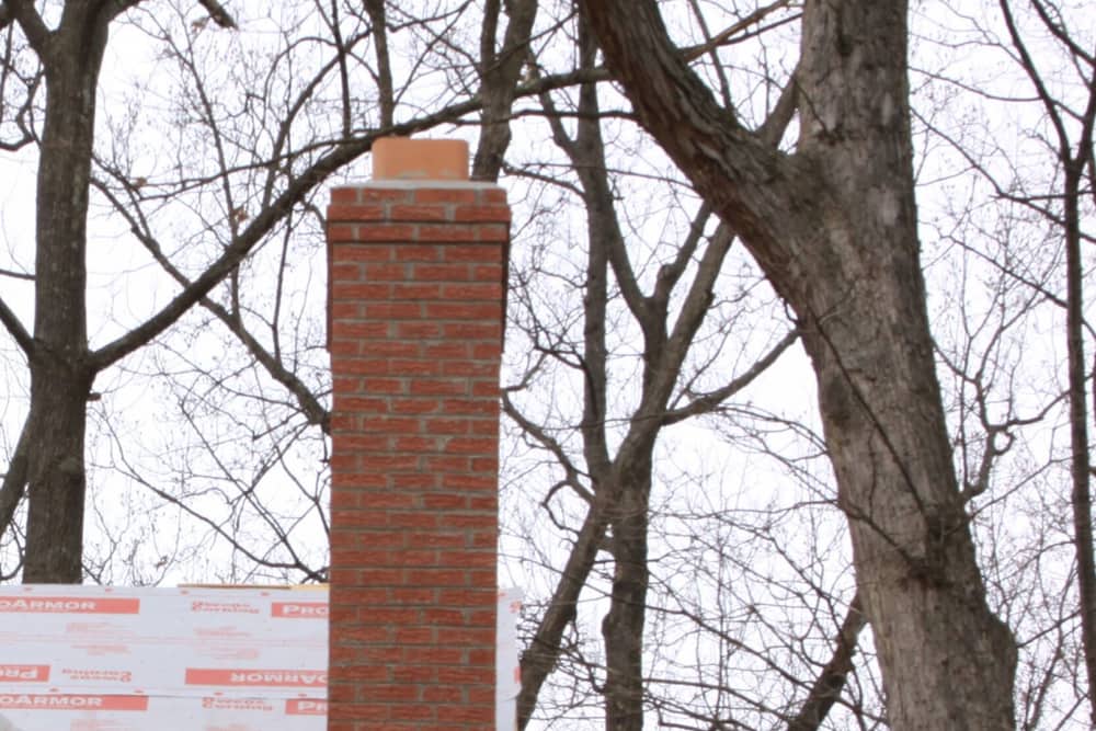 Brick chimney above the roofline on a home in Whiting, NJ