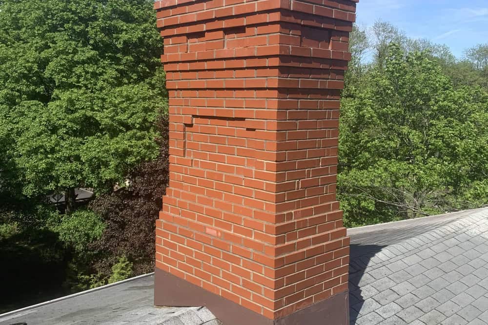 Brick chimney above the roofline on a home in Jackson, NJ